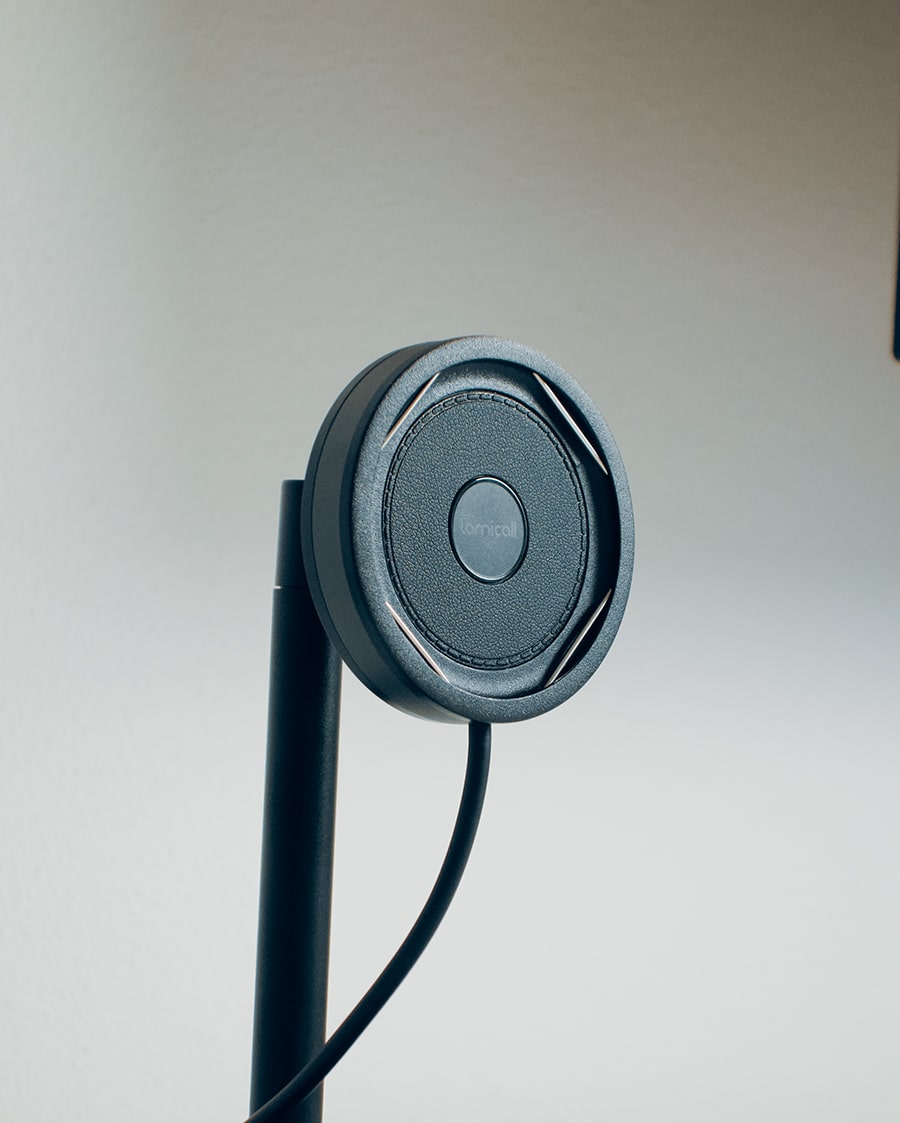Magnetic wireless phone charger showing phone alignment in a workspace